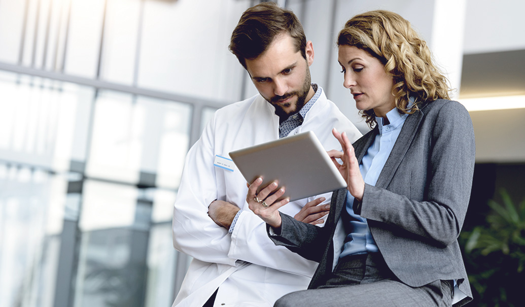 Healthcare professional speaking with a medical sales representative